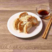 6 Wok Toasted Potstickers · Crescent shaped dumplings filled with pork and veggies with soy dipping sauce.