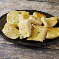 Garlic Bread · Italian bread smothered in homemade garlic butter and toasted to perfection. Add cheese and ...