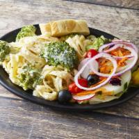 Fettuccine Alfredo · A plateful of the finest fettuccine smothered in our homemade Alfredo sauce and fresh brocco...