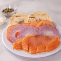 Smoke Salmon Plate · Choice of plain or onion bagel. Serve with cream cheese, sliced tomatoes, red onions and cap...