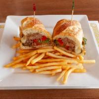 Philly Cheese Steak Sandwich · Served on fresh baguette with sauteed red and green bell peppers, mushrooms, onions and prov...