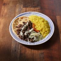 Beef Shawarma Entree · Marinated tri-tip beef, served with onions, tomatoes and tahini sauce.