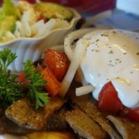 Nalini's Original Gyro · Lamb and beef mixed topped with fresh tomatoes, onions and tzaziki.