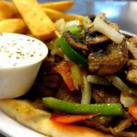Philly Gyro · Topped with grilled onions, peppers, mushrooms and cheddar.