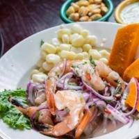 Ceviche Mixto · Sliced fish with octopus, clams and shrimps marinated in spicy lemon juice. Served with swee...