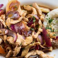Pollo Saltado · Sliced chicken chunks sauteed with red onions and tomatoes. Served over French fries.