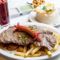 Bistec a Lo Pobre · Steak served with fries, sweet plantains, hot dog, rice and fried egg.