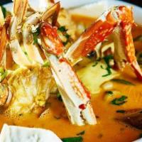 Chupe de Mariscos · Seafood soup with rice and vegetables.