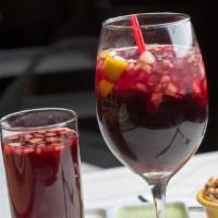 Chicha Morada · Traditional purple corn drink. Served with chopped fruit.