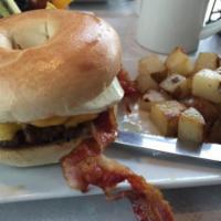 The Corpsman Sandwich · 1 egg cooked to order, American cheese and bacon melted over a hamburger patty on a toasted ...