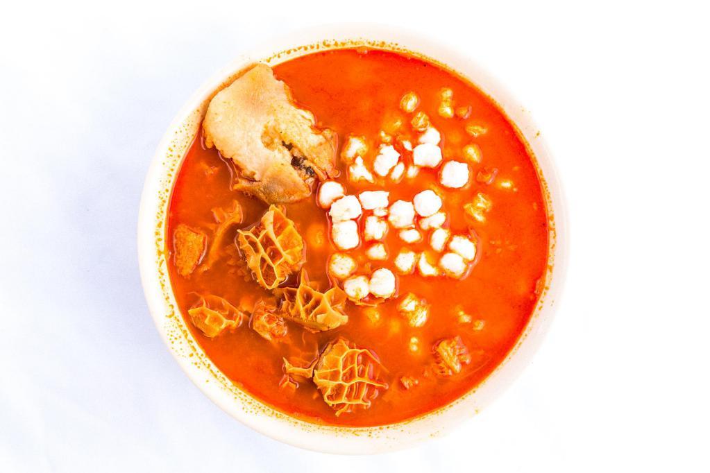 Menudo · Served with hominy and beef feet.