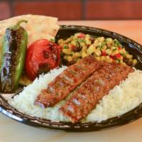 Beef Lule Kabob Plate · Marinated ground beef. Served with basmati rice, grilled tomato, jalapeno, pita bread and ch...