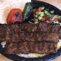 Beef Soltani Kabob Plate · Skewer of beef kabob and beef luleh. Served with basmati rice, grilled tomato, jalapeno, pit...