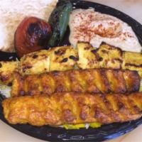 Chicken Soltani Kabob Plate · Skewer of chicken breast and chicken luleh. Served with basmati rice, grilled tomato, jalape...