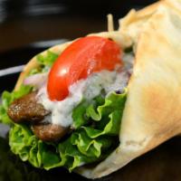 Gyro Sandwich · Beef and lamb, lettuce, tomato, onion and yogurt spread wrapped in pita bread.