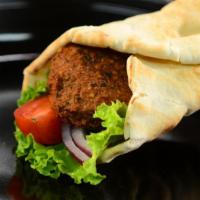 Falafel Sandwich · Served with hummus, lettuce, and red onion wrapped in pita bread. 