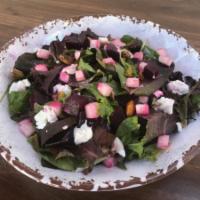 Beet and Jicama Salad · Mixed greens tossed with red beets, jicama and a house-made lemon vinaigrette, topped with g...