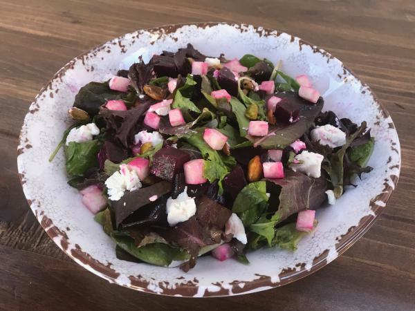 Beet and Jicama Salad · Mixed greens tossed with red beets, jicama and a house-made lemon vinaigrette, topped with goat cheese, and pistachios. Vegetarian.