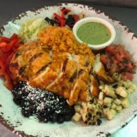 Fiesta Bowl · Mexican rice surrounded by grilled corn, black beans sprinkled with cotija cheese, red peppe...
