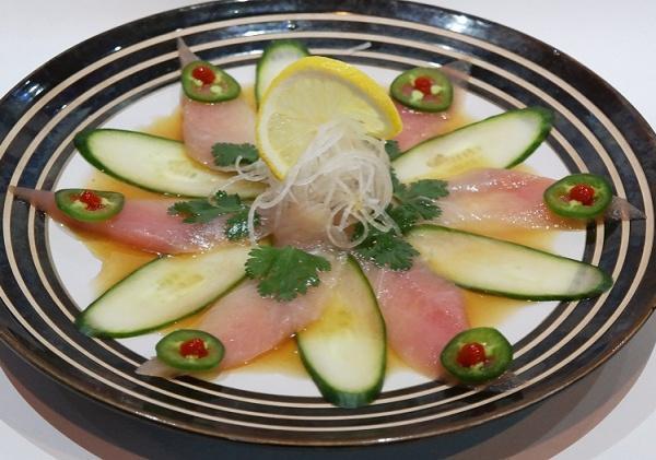 Yellowtail Heaven · Yellowtail sashimi, ponzu sauce, topped with spicy sauce, green onion.