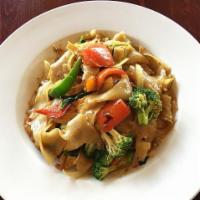 Drunken Noodles (Spicy Basil Noodles) · flat noodles, basil, broccoli, tomato, white onion, bell peppers, spicy sauce
