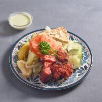 Chicken Salad · Served with lettuce, tomatoes, onions and yogurt sauce on the side.