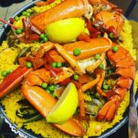 Paelha Marinheira · Combo of lobster, shrimp, clams, mussels, squid and scallops mixed with saffron rice and pea...
