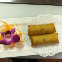 7. Vegetable Spring Roll 2 Pieces · Rice paper or crispy dough filled with shredded vegetables. 