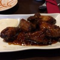 Chicken Wings · 6 pieces. Choice of sauce.