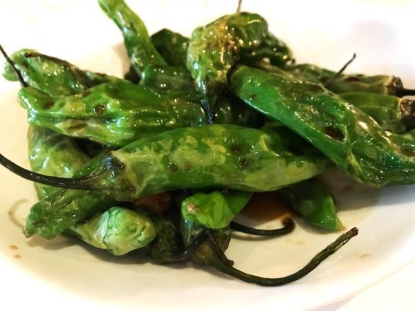 Shishito Peppers · Blistered shishito peppers with soy sauce.