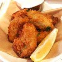 Fried Oyster · Breaded oyster with tartar sauce.
