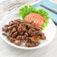 Black Pepper Beef Mignon · Chunks of tender beef wok-stirred with onions in a rich roasted black pepper sauce.