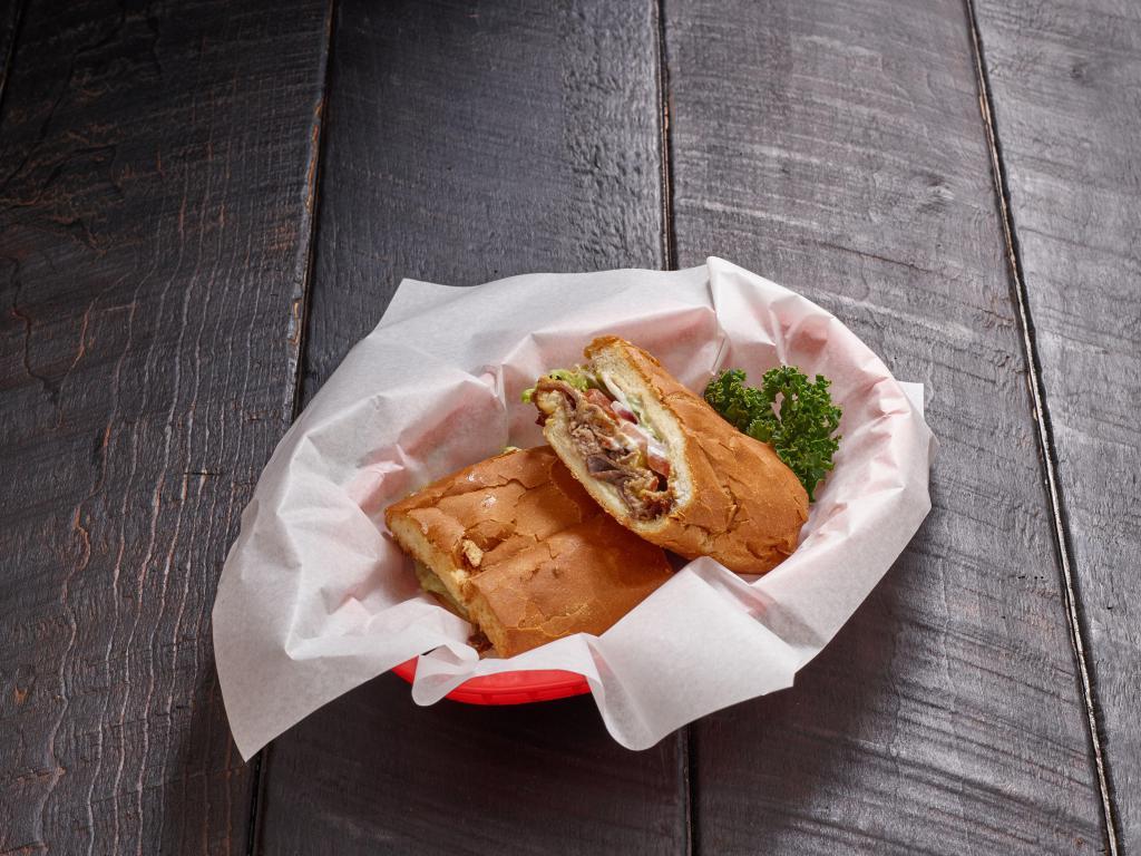 Roast Beef Deli Sub · Served with mayonnaise, mustard, lettuce, tomato and pickles.