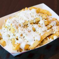 GARLIC FRIES · Seasoned fries, garlic sauce, feta cheese, and oregano.