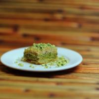 BAKLAWA · House-made baklawa filled with cashews. Topped with pistachios.