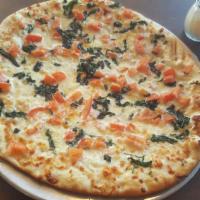 The Margarita Pizza · This pizza is brushed with olive oil and topped with fresh garlic, fresh basil, tomatoes and...