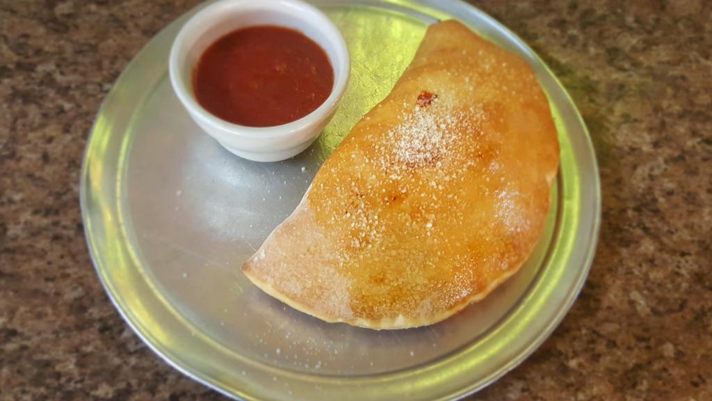 Calzone · Filled with Ricotta and Mozzarella cheese and your choice of hamburger, sausage, pepperoni, or Canadian bacon.
