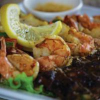 Steak and Shrimp · Grilled New York steak , shrimp and vegetables served with lemon garlic butter sauce and sau...