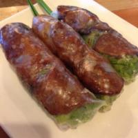 3 Grilled Pork Spring Rolls · Fresh grilled pork spring roll wrapped in rice paper with green salad, mint, pickled daikon,...