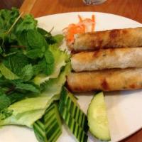 5 Fried Shrimp Eggrolls · Crispy fried rice paper rolled with shrimp served with green salad, mint, pickled daikon, cu...