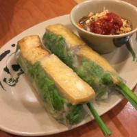 2 Tofu Spring Rolls · Fresh crispy tofu spring roll wrapped in rice paper with green salad, mint, pickled daikon, ...