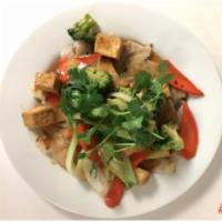 Rice Noodle Stir Fried Plate · Pan fried rice noodles with stir fried tofu, bok choy, broccoli, carrots, onion and cilantro.