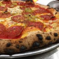Pepperoni with Banana Peppers Pizza · Our house tomato sauce, sliced pepperoni and roasted banana peppers with our house cheese bl...