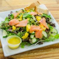 High Protein Salad · Spring Greens, Smoked Salmon, Quinoa, Cucumber, Dried cranberries, Avocado, and Mango. Serve...