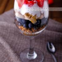 Granola Parfait · Street cut organic oatmeal, served with banana, blueberries, slivered almond, Greek yogurt, ...