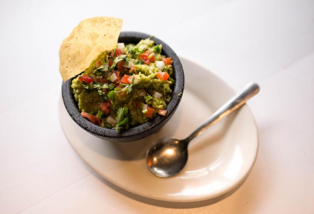 Jefe's Guacamole Dip · Fresh avocados tossed with diced tomatoes, onions, cilantro, squeezed lime juice, and a touch of salt. Mixed to perfection every single day for our amazing, homemade guacamole dip!
