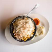 Elote Loko · Sweet corn mixed with mayonnaise, butter, parmesan cheese. Topped with cayenne peppers and f...