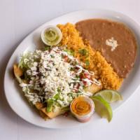 Gio's Flautas · 5 Fried corn tortilla stuffed with your choice of beef or chicken dressed with guacamole, le...