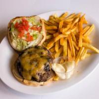 Classic Cheeseburger · Burger dressed with American cheese, sliced tomatoes, onions, lettuce, and mayonnaise. Serve...