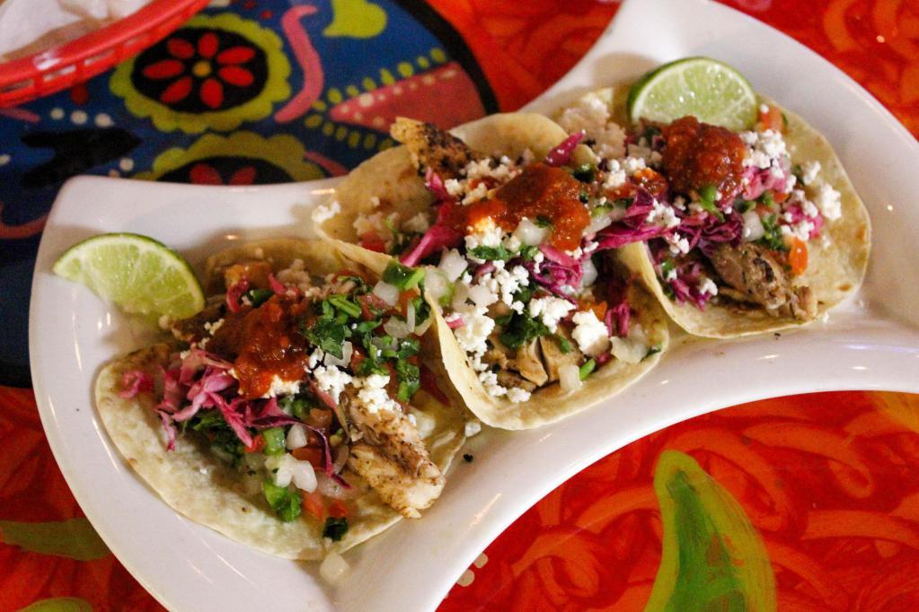 Seafood Tacos (2) · Tacos dressed with seasoned red cabbage, pico de gallo, queso fresco, and our delicious homemade chipotle sauce!